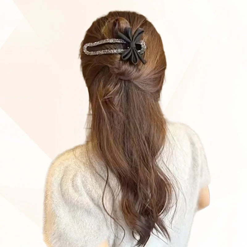 Glitrende elegante hårspenner med svart sløyfe